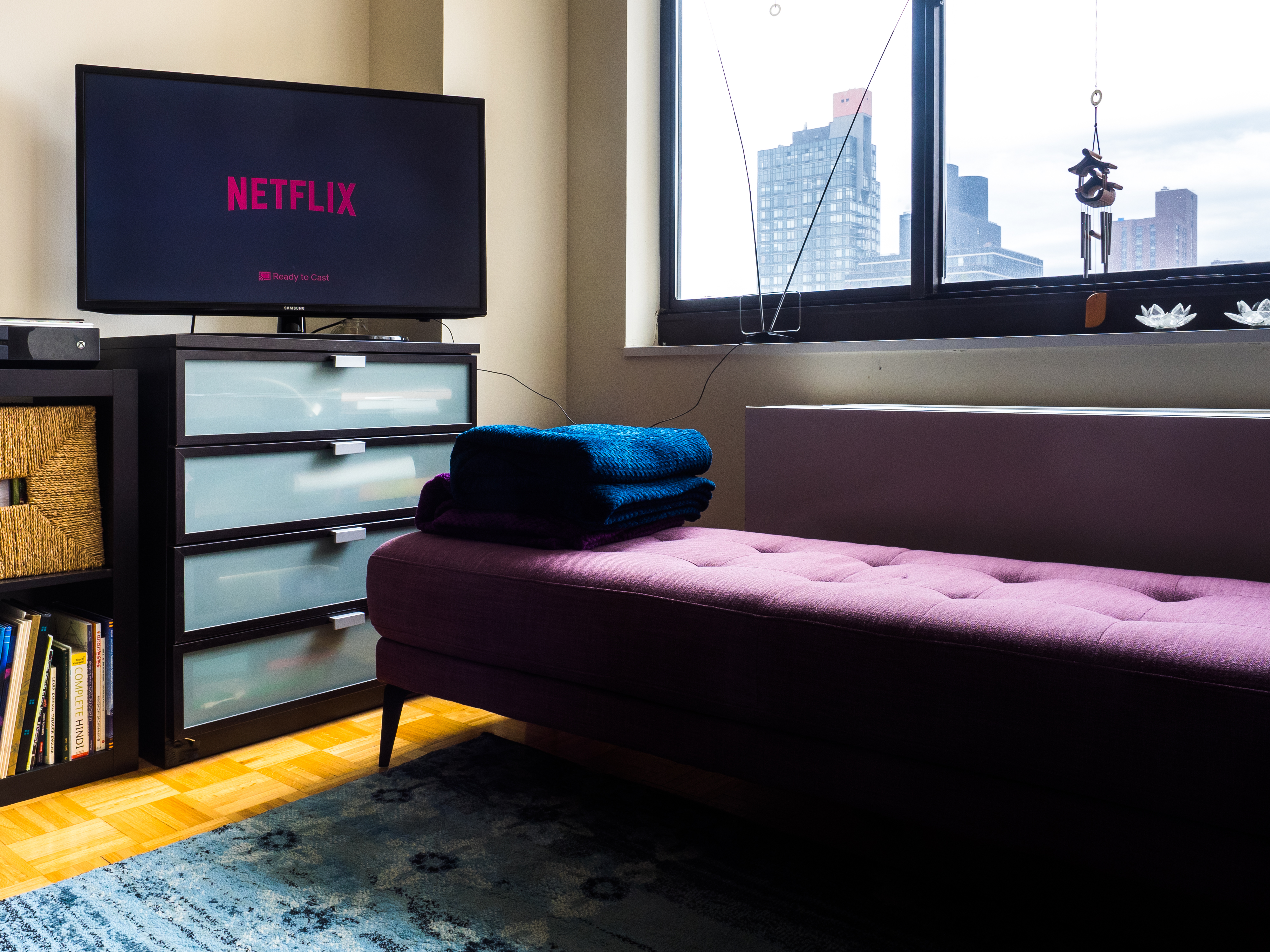Person enjoying TV series binge watching session at home